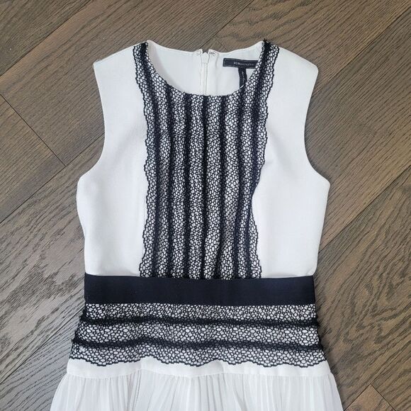 BCBGMAXAZRIA Adelyn Pleated Lace Sleeveless Hi Low Dress in White & Black - Picture 6 of 16